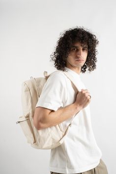 Amiacalva's perfect backpack with adjustable cushioned shoulder straps and one large exterior pocket in a durable cotton canvas. Finished with tonal zippers. Unlined. 100% Cotton Made in Japan Standard Cotton Backpack With Canvas Lining, Versatile Rectangular Canvas Backpack, Everyday Canvas-lined Standard Backpack, Coated Canvas Backpack For On-the-go, Luxury Coated Canvas Backpack For On-the-go, Pantry Decor, Garden Clogs, Studio Nicholson, Knit Outerwear