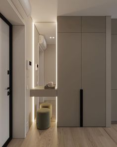 a modern bathroom with white walls and wood flooring, lighted by recessed lighting