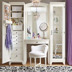 a bedroom with white furniture and purple curtains