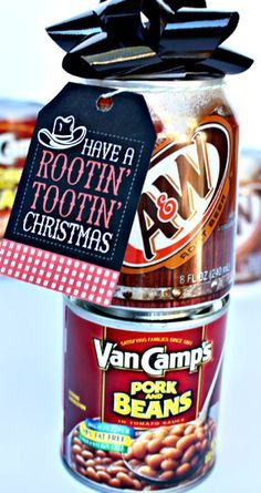 a can with some candy in it and a tag on top of it that says have a rootin'toothin'christmas