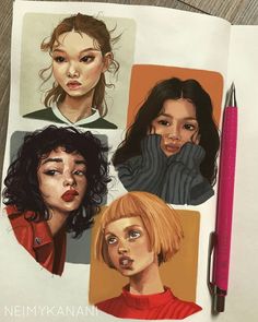 an open notebook with drawings of girls on it and a pen in the middle, next to them