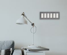 a desk lamp sitting on top of a white table