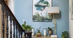 a room with blue walls and wooden stairs