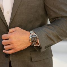 You'll appreciate the modern technology and sleek two-toned details of this men's Bulova Curv chronograph watch with a black dial. The black dial features gold-toned hands and markers, a stripe-patterned design along the face, a trio of chronograph sub-dials and a translucent ring offering a glimpse at the intricate movement beneath. 44.0mm brushed and polished stainless steel case with anti-reflective curved sapphire crystal and a gold-toned ion-plated bezel High precision quartz movement with a frequency of 262kHz - eight times greater than standard quartz - keeps accurate time. The stainless steel link bracelet showcases gold-toned ion-plated accent along the sides and secures with a push-button deployment clasp. Water resistant to 30 meters, this watch includes a 3-year limited manufac Elegant Chronograph Watch With Tachymeter For Formal Occasions, Elegant Formal Watch Accessories With Tachymeter, Elegant Chronograph Watch With Tachymeter, Luxury Skeleton Dial Chronograph Watch For Formal Occasions, Luxury Automatic Chronograph Watch For Business, Classic Formal Chronograph Watch With Metal Dial, Formal Chronograph Watch With Round Dial, Timeless Chronograph Watch With Subdials For Business, Formal Chronograph Watch With Tachymeter And Round Dial