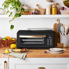 a toaster oven sitting on top of a wooden counter