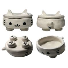 three ceramic bowls with cats on them and one bowl has two kittens in it