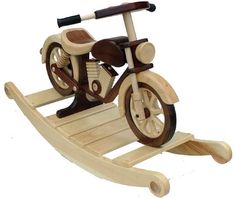 a wooden toy bike is shown on a white background