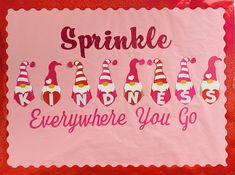 a pink sign that says sprinkle kindness everywhere you go with some candy on it