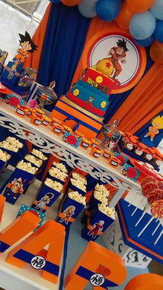 an orange and blue birthday party with decorations