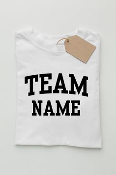 Heat Transfer Decoration Front Team Name Print  Back Name and Number Print 4.3-ounce, 100% combed ring spun cotton 50/50 combed ring spun cotton/poly Slightly slimmer body and shorter sleeves 1x1 rib knit neck Shoulder to shoulder taping Custom Team Name T-shirt For Team Spirit, School T-shirt With Team Name, Customizable Team Spirit T-shirt With Team Name, Team Spirit Cotton T-shirt With Team Name, Graphic Tee T-shirt With Team Name In Cotton, School Team Shirts, Text Shirt, School Team, Team T Shirts