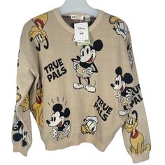 a sweater with mickey mouse on it and other disney characters all over the top,