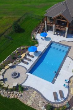 an aerial view of a pool and patio area