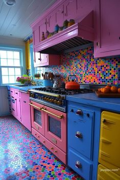 a colorful kitchen with multicolored cabinets and counters in the center is an oven