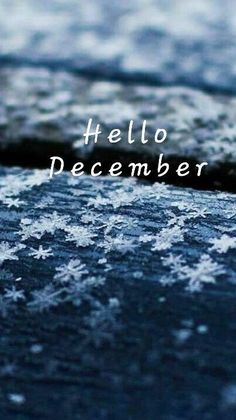 the words hello december are written in white snow flakes