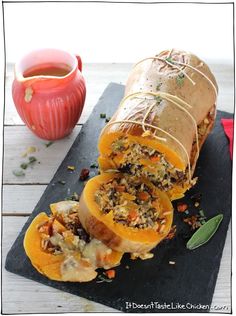 the stuffed pumpkins are ready to be eaten on the cutting board and served with sauce