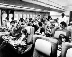 an airplane filled with lots of people eating food