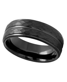 a wedding band with black carbon inlays and an intricate pattern on the inside