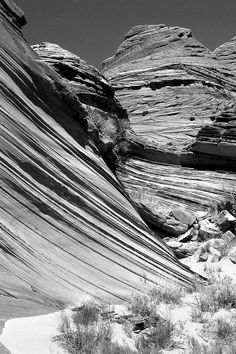 black and white photograph of rock formations in the desert