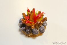 a close up view of some food on a white surface with red, yellow and orange flowers