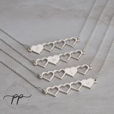 "These four heart initial necklaces make a gorgeous set to share amongst sisters or best friends. The necklaces are designed so that each pendant has one full heart and three cut out hearts, symbolizing the others who share the same necklace set. These jewelry sets help to create and strengthen bonds between friends and sisters. It helps keep people feeling close even when they may geographically be far away from one another. Each pendant can be engraved with any initial of your choice. The engr Best Friend Necklaces For 4 People, Heart Charm Double Heart Necklace For Best Friend, Double Heart Charm Necklace For Best Friend, Personalized Double Heart Necklace For Best Friend, Silver Double Heart Jewelry With Initials, Heart Charm Double Heart Jewelry For Best Friend, Double Heart Charm Jewelry For Best Friend, Sterling Silver Double Heart Initial Necklace, Sterling Silver Double Heart Necklace With Initials