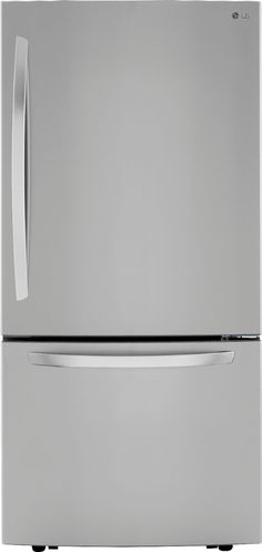 a silver refrigerator freezer sitting on top of a white counter