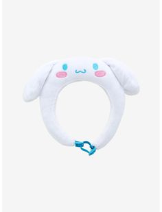 a white stuffed animal ring with blue eyes and pink ears, on a white background