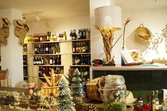 a room filled with lots of bottles and baskets on top of it's shelves