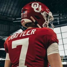 a football player wearing a red and white uniform