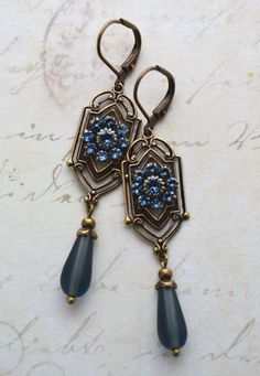 VINTAGE ELEMENTS Unique Jewellery, Handmade from Vintage Inspired Original Designs Art Nouveau, Art Deco, Edwardian, Victorian style Earrings with  Denim Blue Swarovski Crystals and Frosted Glass Teardrop. These earrings are made with antiqued brass  leverback earwires and measure 6.2cm from the top of the earwires. Victorian Style Earrings, Antique Gold Earrings, Blue Crystal Earrings, Edwardian Art, Art Nouveau Art, Deco Earrings, Nouveau Art, Magical Jewelry, Funky Jewelry