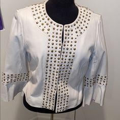 Rare!!!Supple White Genuine Leather Trimmed In Gold Tone Studs. Front Eye & Clamp Closure. Flared 3/4 Length Sleeves. Fully Lined. One Stud Missing. Excellent Condition. Edgy & Fierce Edgy White Leather Jacket For Spring, White Fitted Edgy Leather Jacket, White Fitted Chic Leather Jacket, White Fitted Edgy Outerwear, White Fitted Leather Jacket For Spring, Elegant Fitted White Leather Jacket, Studded Leather Jacket, Studded Jacket, Studded Leather