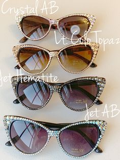 Make a huge statement with these absolutely stunning crystal sunglasses! You wont be disappointedso much WOW These frames measures approx. 6 inches across the top of the points, and about 2.5 inches in total length. Very comfortable fit, with 400 high UV protection. Color choices include: Crystal (clear) on black frame Crystal AB (iridescent) on brown torti frame Light Peach on brown torti frame Light Colo Topaz is a light gold crystal on a brown torti frame Rose (pink) on brown torti frame Blac Clear Cat Eye Sunglasses For Party, Party Clear Cat Eye Sunglasses, Bling Sunglasses, Jewelry Closet, Trendy Eyewear, Crystal Sunglasses, Fleece Headbands, Rhinestone Sunglasses, Frame Light