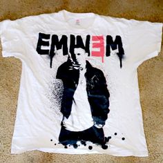 a white shirt with an image of emim on it