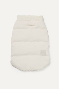 a white puffy dog coat on a white background