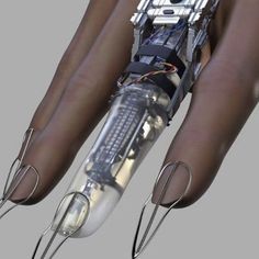 an image of a robotic hand with wires attached to the arm and fingers on it