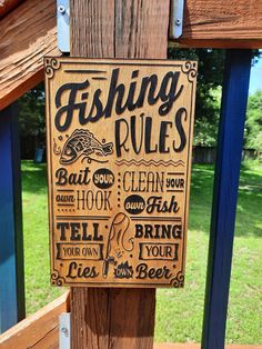 a wooden sign that says fishing rules on it