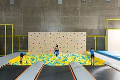 children playing on an indoor trampoline course