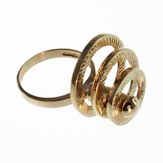 Three fluted circle motion ring in 14k gold.  These unique and eye-catching rings utilize a stainless steel center shaft for strength and durability and a precision ball bearing system for movement. All of the other parts of the ring are solid 14k gold. This ring is precision engineered with a counter balance to create smooth, fluid movement. Our motion rings require virtually no special care (beyond that which you treat your other fine jewelry items).  Ring size 7 in White Gold is available and ready to ship. If you want the ring custom sized, let us know and we can do that. If you have any questions please ask. Please note that all motion rings custom sized take 1-2 weeks to get ready and ship. And ring sizes over size 8 has an additional charge of $95 dollars. Modern Spiral Ring For Formal Occasions, Modern Spiral Rings For Formal Occasions, Modern Spiral Yellow Gold Ring, Modern Yellow Gold Spiral Ring, Modern Gold Spiral Ring, Counter Balance, Fluid Movement, Circle Ring, Ball Bearing