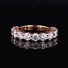 a diamond ring on a black background