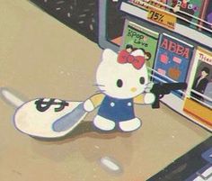 a hello kitty doll sitting on top of a table