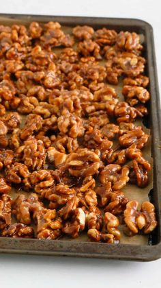 a tray filled with nuts sitting on top of a table