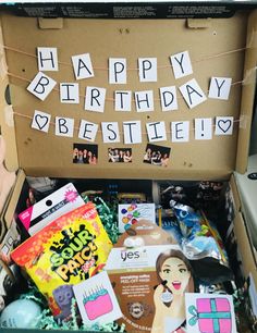 an open box filled with lots of different items and words on the side that spell out happy birthday