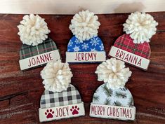 four personalized christmas hats with pom poms