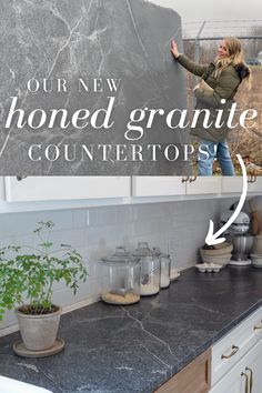 a woman standing on top of a kitchen counter next to a blackboard with the words, our new homemade granite countertops