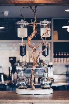 a tree made out of glass bottles on top of a counter