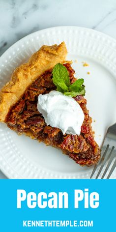 a piece of pecan pie on a white plate with whipped cream and mint garnish