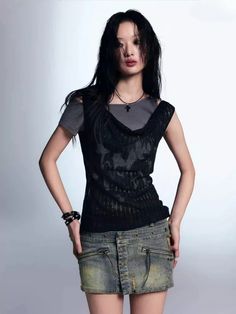 The Gothic Top combines a raw, edgy aesthetic with a unique layered look. Featuring a draped neckline and a semi-sheer overlay, this top adds depth and texture to any outfit. The contrasting layers create a distressed, lived-in feel, making it an ideal choice for those who appreciate alternative fashion and want to make a bold statement. Goth aesthetic Sheer knit top & basic top layered design Print detail at front Asymmetric neck Polyester Spring Gothic Mesh Top, Fitted Tops With Fake Two-piece For Layering, Trendy Distressed Tops For Night Out, Distressed Tops For Night Out In Spring, Distressed Tops For Spring Night Out, Alternative Fitted Distressed Tops, Fitted Distressed Alternative Tops, Distressed Fitted Alternative Top, Edgy Fitted Distressed Top