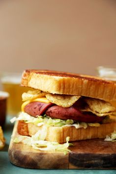 a close up of a sandwich on a cutting board