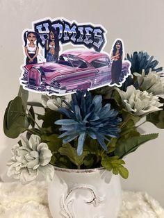 a vase filled with flowers and stickers on top of a table