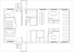 the floor plan for an office with tables and chairs, seating areas, and desks