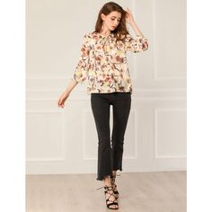 The elegant floral pattern adds dramatic styling to the semi-sheer 3/4 sleeve blouse. Full of romantic charm, this lightweight blouse is accented with a ruffle sleeve and a tie v-neck. An elegant tie-neck and half sleeves with elastic cuffs enhance the casual softy grace of the floral blouse in a loose H silhouette. Wear it with open-toe sandals and casual pants for an effortlessly feminine look. Floral Bow Tie, Women's Blouses, Open Toe Sandals, Feminine Look, Tie Neck, Blouse Styles, Floral Blouse, Printed Blouse, Half Sleeves